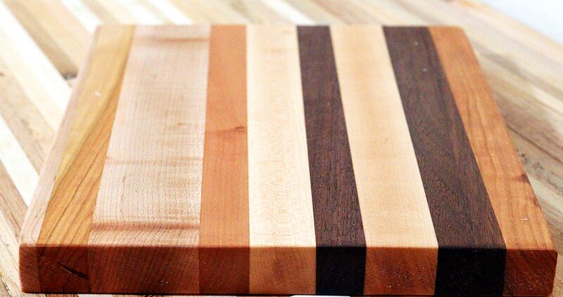 Striped edge-grain cutting board in maple, cherry and walnut