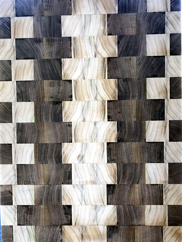 Tall end-grain board with a woven pattern of light and dark wood