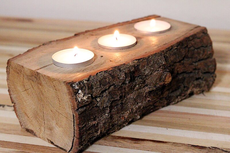 Log candle holder with bark intact and three tea lights