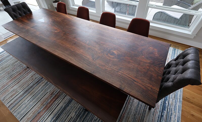 Gathering Place: a ten-foot walnut table set with leather chairs