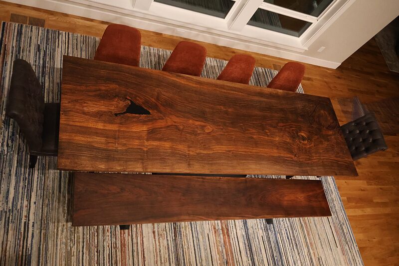 Looking down the length of the walnut top toward the windows